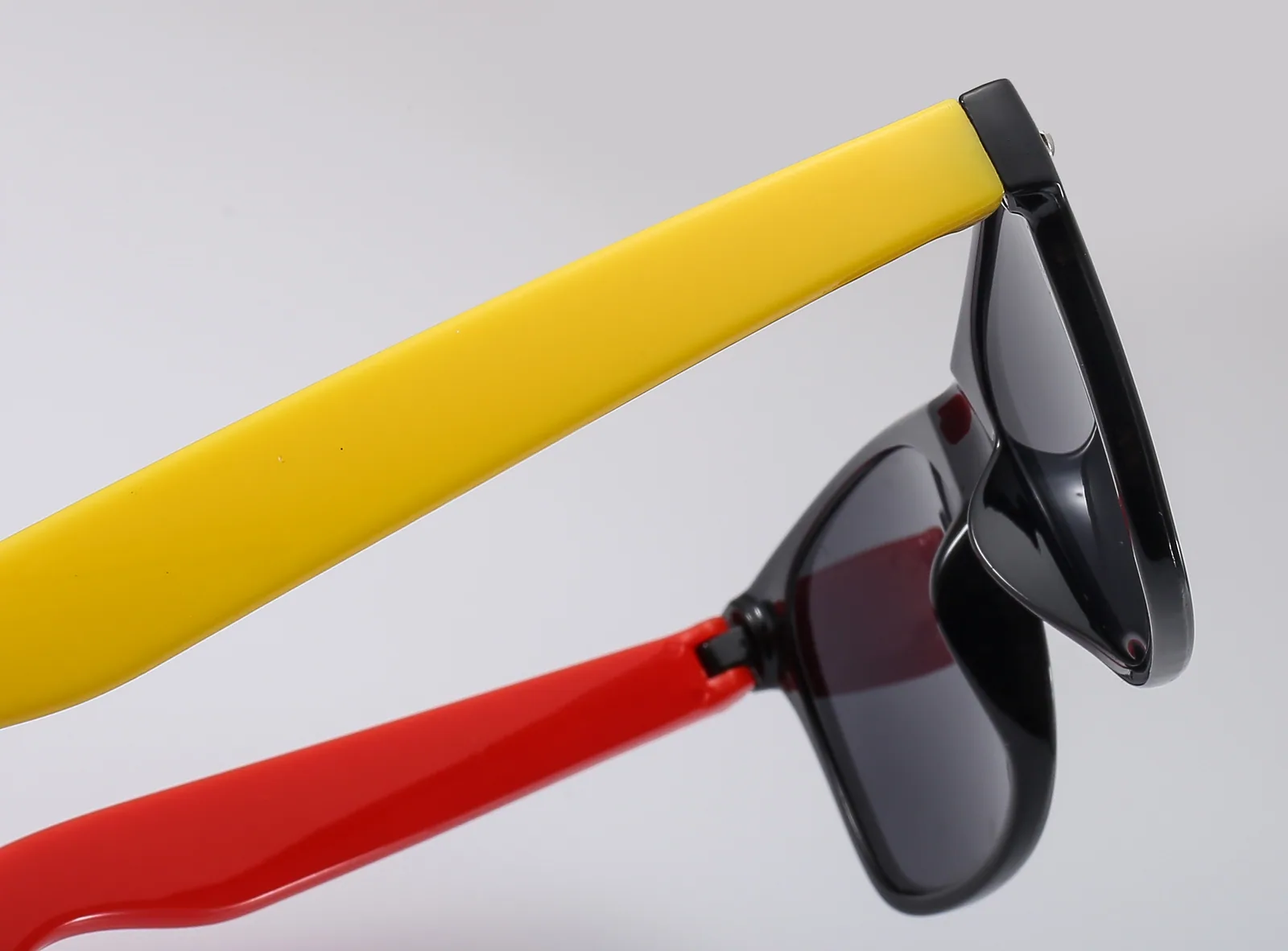 Broad temple surface for logo customization on bottle-opener sunglasses